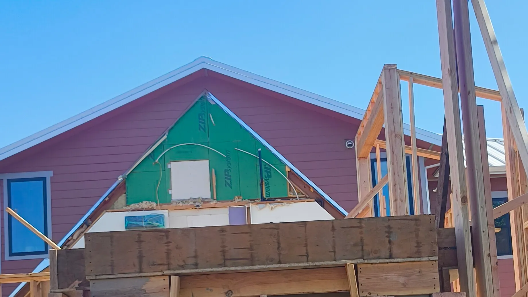 Framing and a ZIP-sheathed gable on a CCI Builders new build in El Dorado County